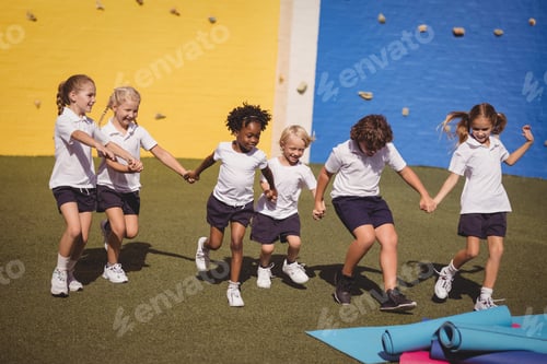 Preview: Schoolgirls Running With Hand In Hand In Schoolyard