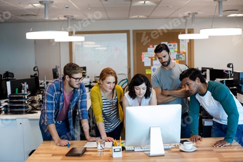 Preview: Creative Business Team Working Together On Desktop Pc In Office
