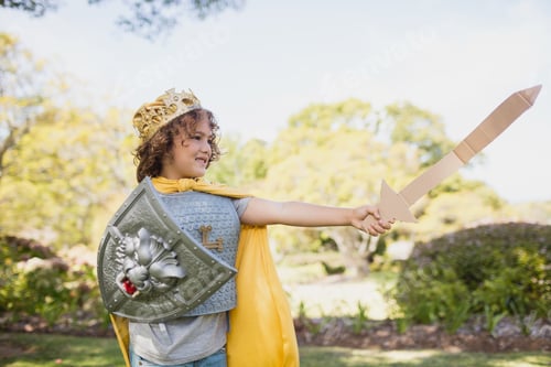 Preview: Profile View Of Boy Dressing Up In Knight In Park