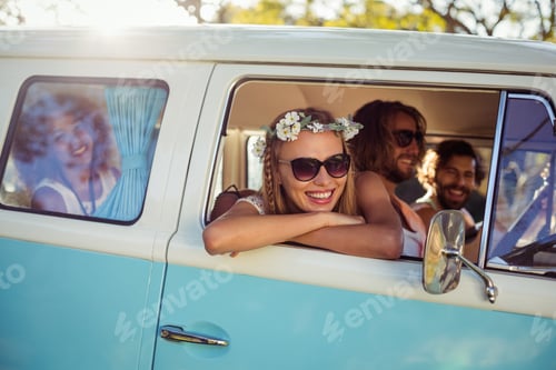 Preview: Smiling Woman Looking Out Of Camper Van Window On A Sunny Day