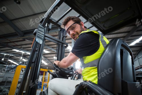 Preview: Portrait Of Smiling Factory Worker Driving Forklift In Factory