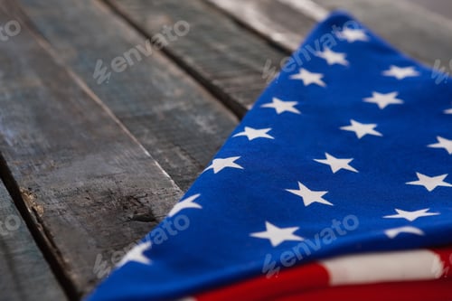Preview: Close-Up Of Folded American Flag On Wooden Table