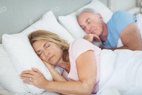Preview: Senior Couple Sleeping Together On Bed In Bedroom