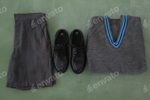 Preview: Close-Up Of School Uniform Arranged On Chalkboard