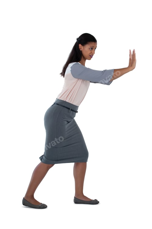 Preview: Side View Of Businesswoman Pushing Against White Background