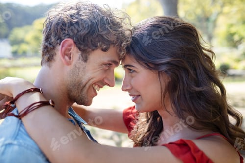 Preview: Romantic Couple Looking At Each Other In Park On A Sunny Day
