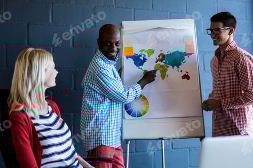 Preview: Colleagues Discussing With World Map On White Board In The Office