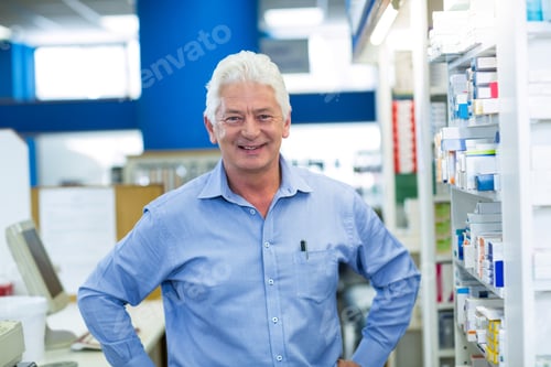 Preview: Portrait Of Pharmacist Standing With Hand On Hip In Pharmacy