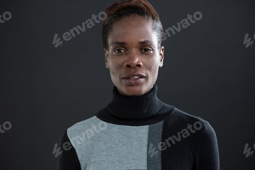 Preview: Portrait Of Androgynous Man Against Grey Background