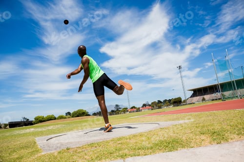 Preview: Male Athlete Throwing Shot Put Ball In Stadium