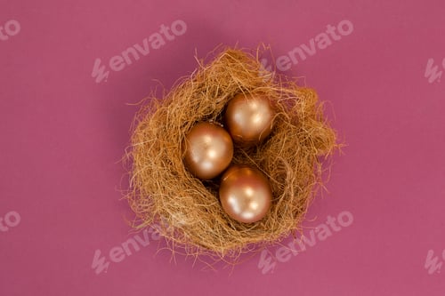 Preview: Golden Easter Eggs In The Nest On Pink Background