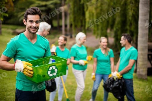 Preview: Portrait Of Recycling Team Member Standing In Park