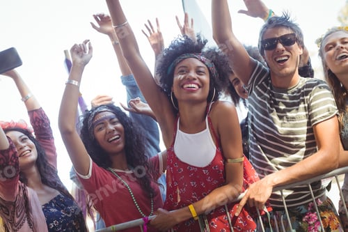 Preview: Cheerful Friends By Railing Enjoying At Music Festival