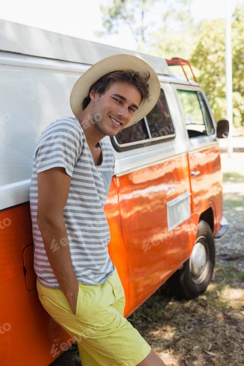 Preview: Portrait Of Man Leaning On Camper Van In The Park