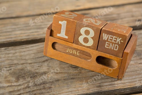 Preview: High Angle View Of Wooden Calender On Table