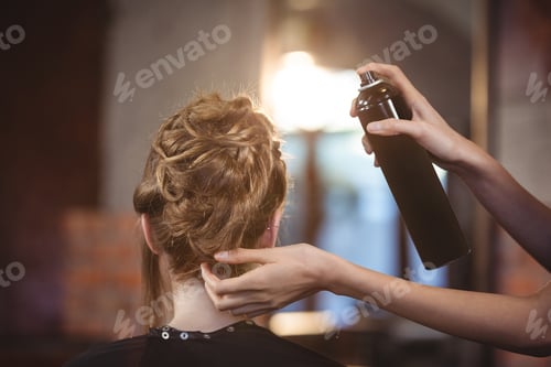 Preview: Female Hairdresser Styling Customers Hair At A Salon