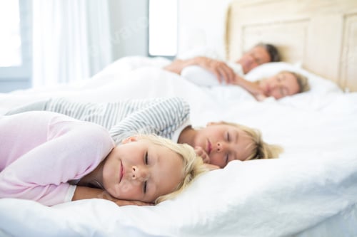 Preview: Family Sleeping On Bed In The Bed Room At Home