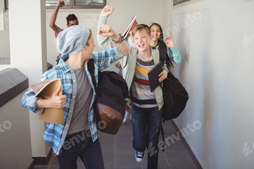 Preview: Group Of Classmate Running In Corridor At School