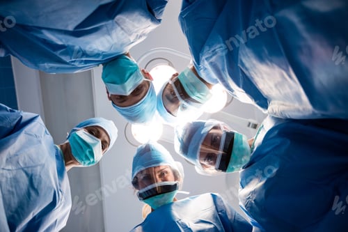 Preview: Group Of Surgeons Looking At Camera In Operation Room At The Hospital. Healthcare Workers In The