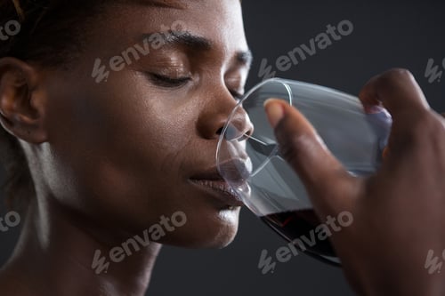 Preview: Close-Up Of Androgynous Man Drinking Wine From Glass