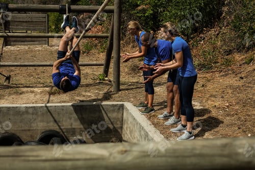 Preview: Fit Man Crossing The Rope During Obstacle Course While People Cheering Him