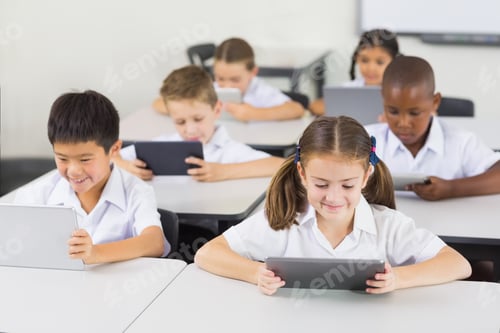 Preview: School Kids Using Digital Tablet In Classroom At Elementary School