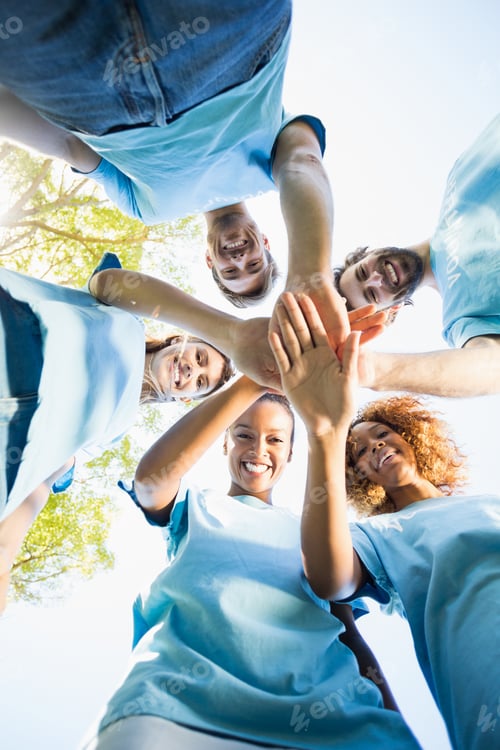 Preview: Portrait Of Volunteer Group Forming Huddles In Park