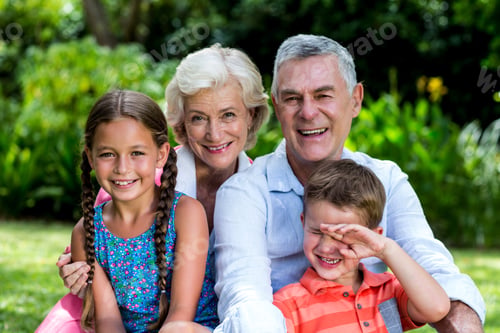 Preview: Cheerful Children With Grandparents Sitting At Yard