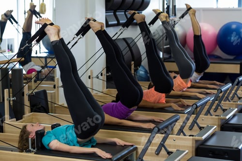 Preview: Group Of Women Exercising On Reformer In Gym