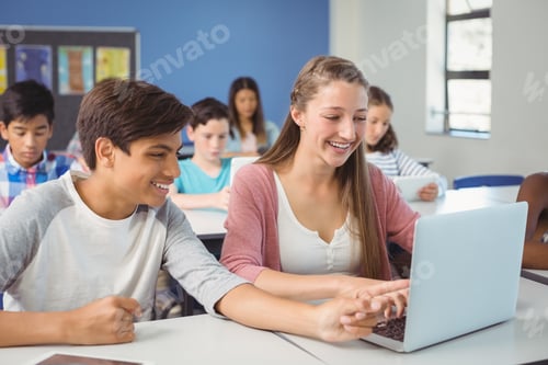 Preview: Students Using Digital Tablet And Laptop In Classroom At School