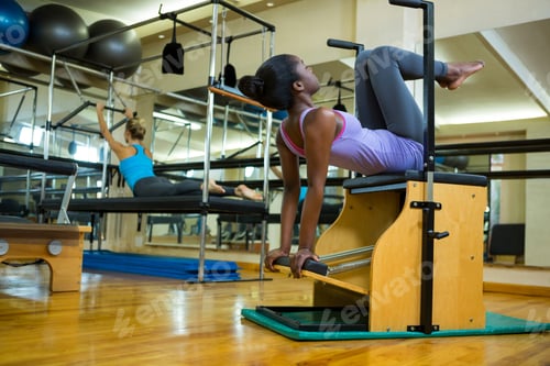 Preview: Woman Exercising On Wunda Chair In Gym