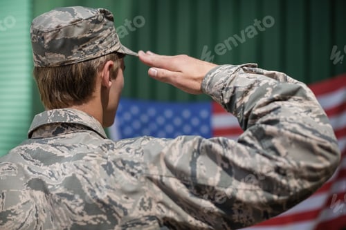 Preview: Rear View Of Military Soldier Giving Salute To American Flag In Boot Camp