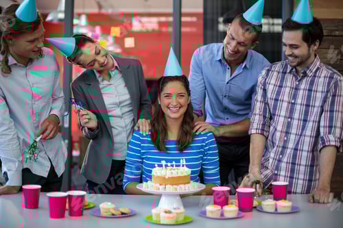 Preview: Businesspeople Celebrating Their Colleagues Birthday In Office