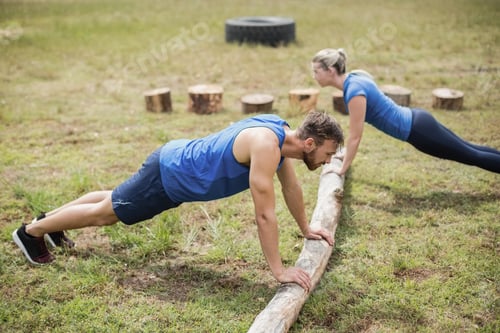 Preview: Fit People Performing Pushup Exercise In Boot Camp