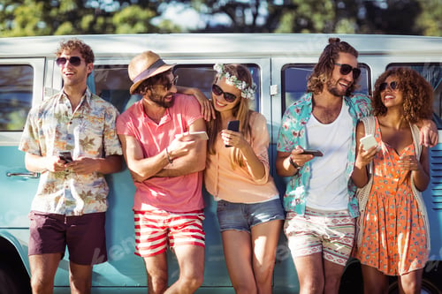 Preview: Group Of Friends Using Mobile Phone