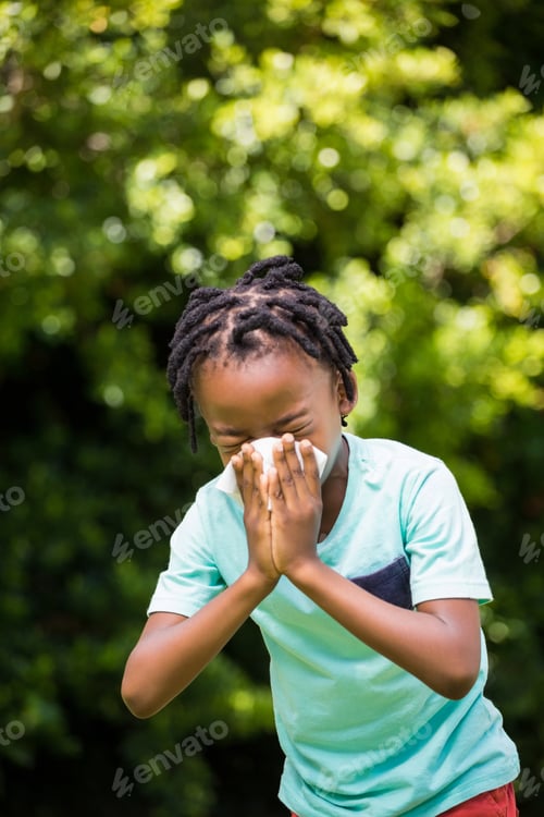 Preview: Boy Sneezing His Nose In The Park