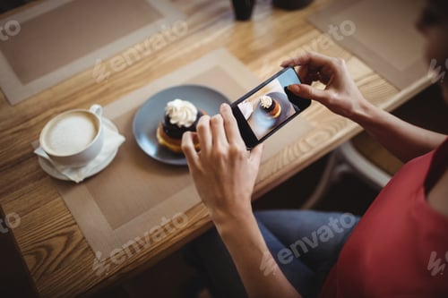 Preview: Woman Taking A Photo Of Sweet Food From Mobile Phone In Bakery Shop