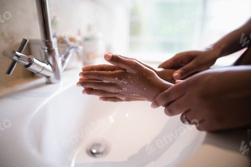 Preview: Cropped Hands Of Mother Assisting Girl While Washing Hands At Bathroom Sink, Coronavirus Hand