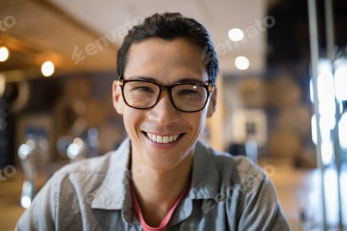 Preview: Portrait Of Smiling Man Sitting In Restaurant