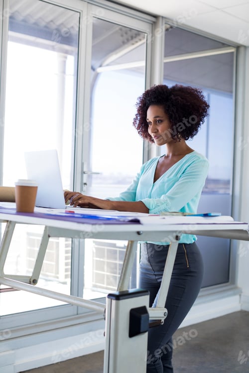 Preview: Female Architect Working Over Laptop In Office