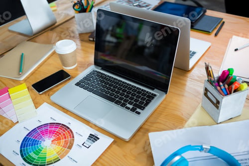 Preview: Laptop, Color Swatch And Mobile Phone On Desk In Creative Office