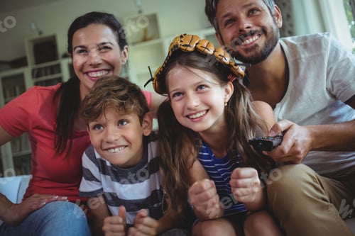 Preview: Family Having Fun In Living Room At Home