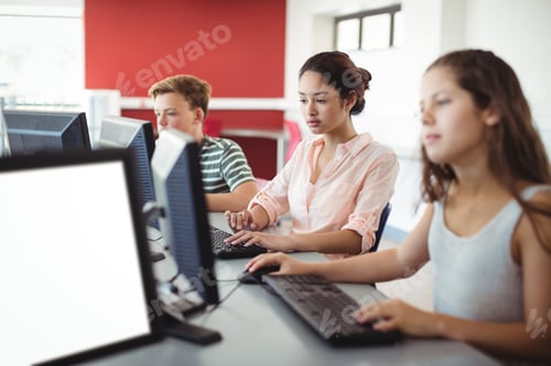 Preview: Students Using Computer In Classroom At School
