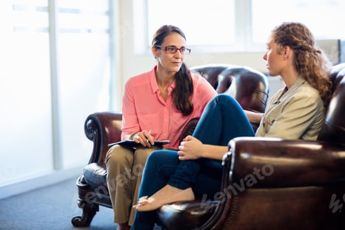 Preview: Psychologist Having Session With Her Patient In Office