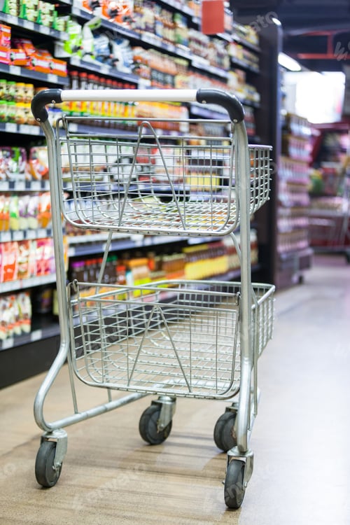 Preview: Empty Shopping Cart In Grocery Section Of Supermarket