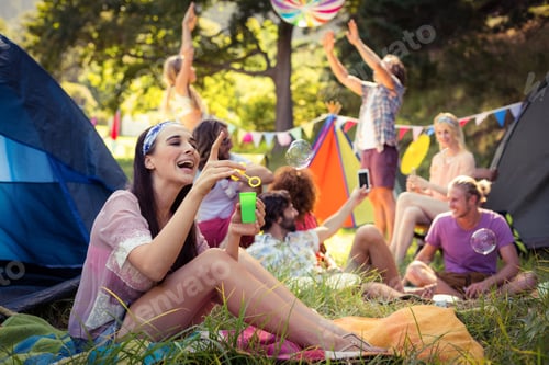 Preview: Woman Having Fun At Campsite On A Sunny Day