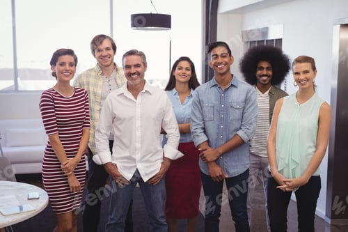 Preview: Portrait Of Smiling Business Team Standing In Creative Office