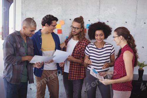 Preview: Group Of Business People Having Discussion In Creative Office