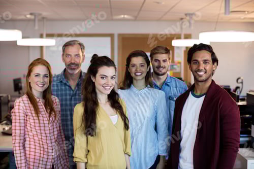Preview: Portrait Of Creative Business Team Standing Together In Office