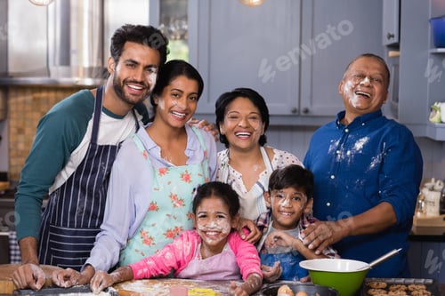 Preview: Portrait Of Cheerful Multi-Generation Family Enjoying While Preparing Food In Kitchen At Home